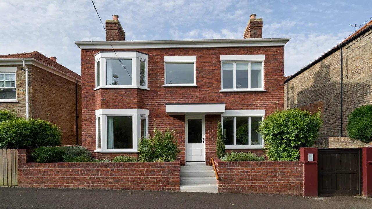 New windows fitted to the front of a brick terraced house