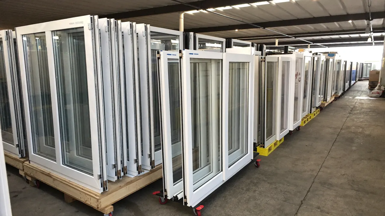 New uPVC window frames stacked in a manufacturer's warehouse